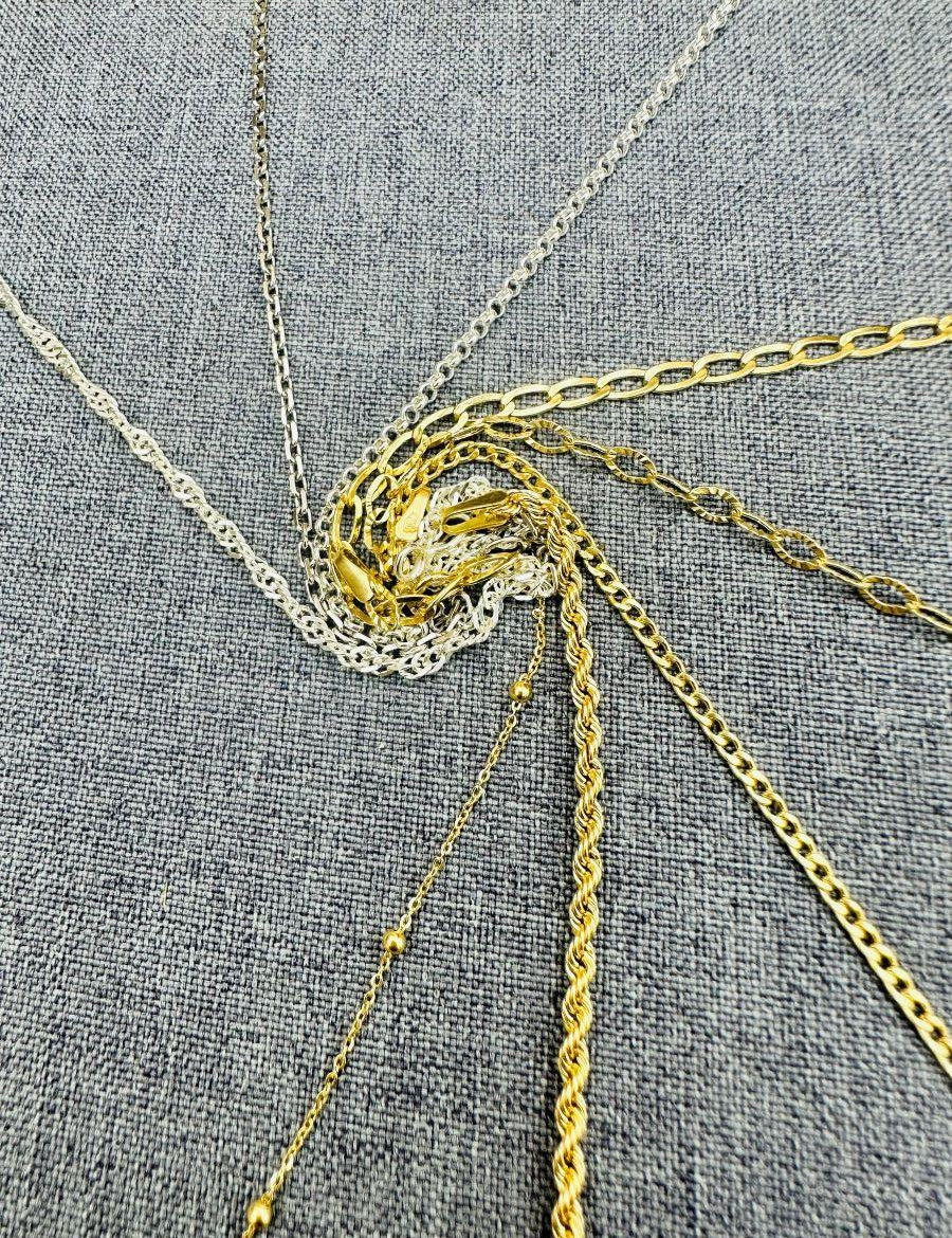 Pourquoi Opter pour l'Or 18 Carats et l'Argent 925 dans la Création de Vos Bijoux Personnalisés ?