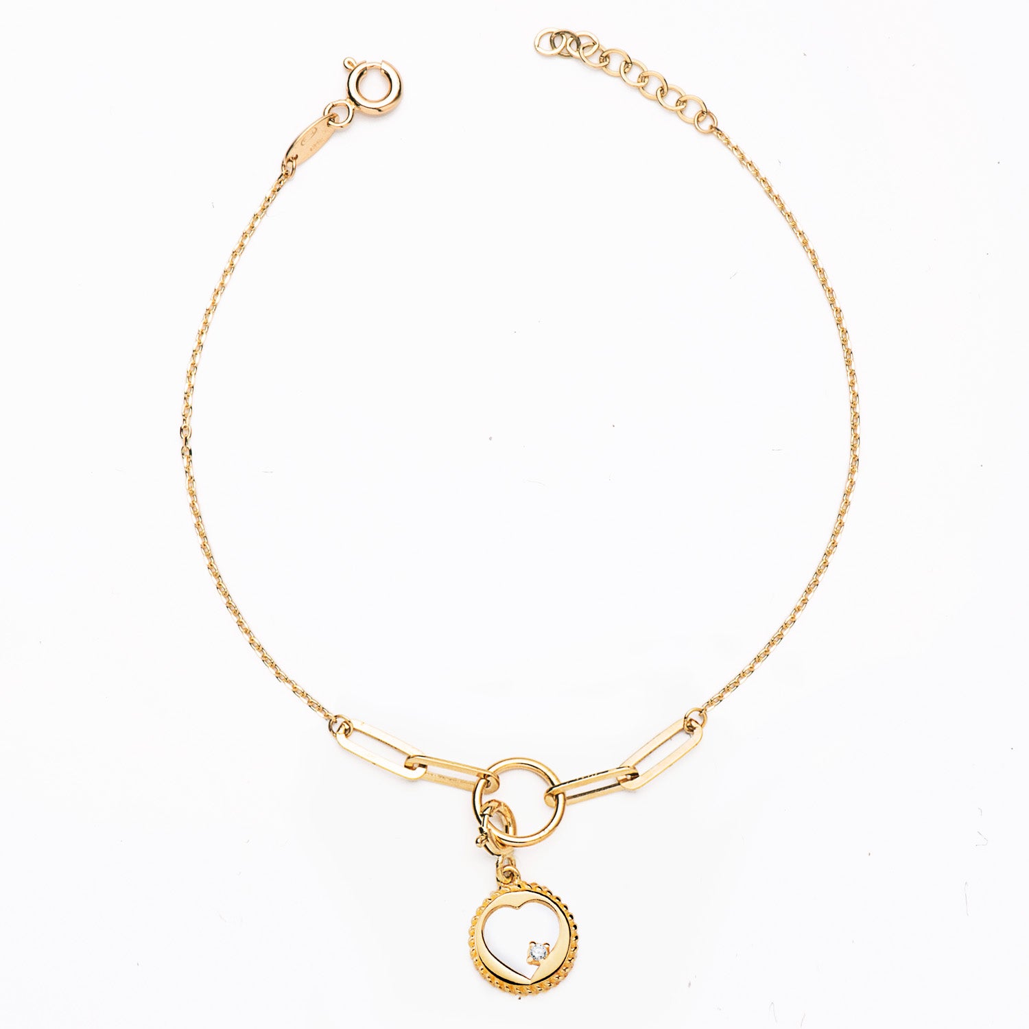 Bracelet "Cœur Lien" maille Forçat fine et jeton motif cœur ajouré en or 18 carats