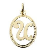 Pendentif ou jeton "Oméga", lettre stylisée ajourée en or jaune 18 carats