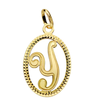 Pendentif ou jeton "Oméga", lettre stylisée ajourée en or jaune 18 carats
